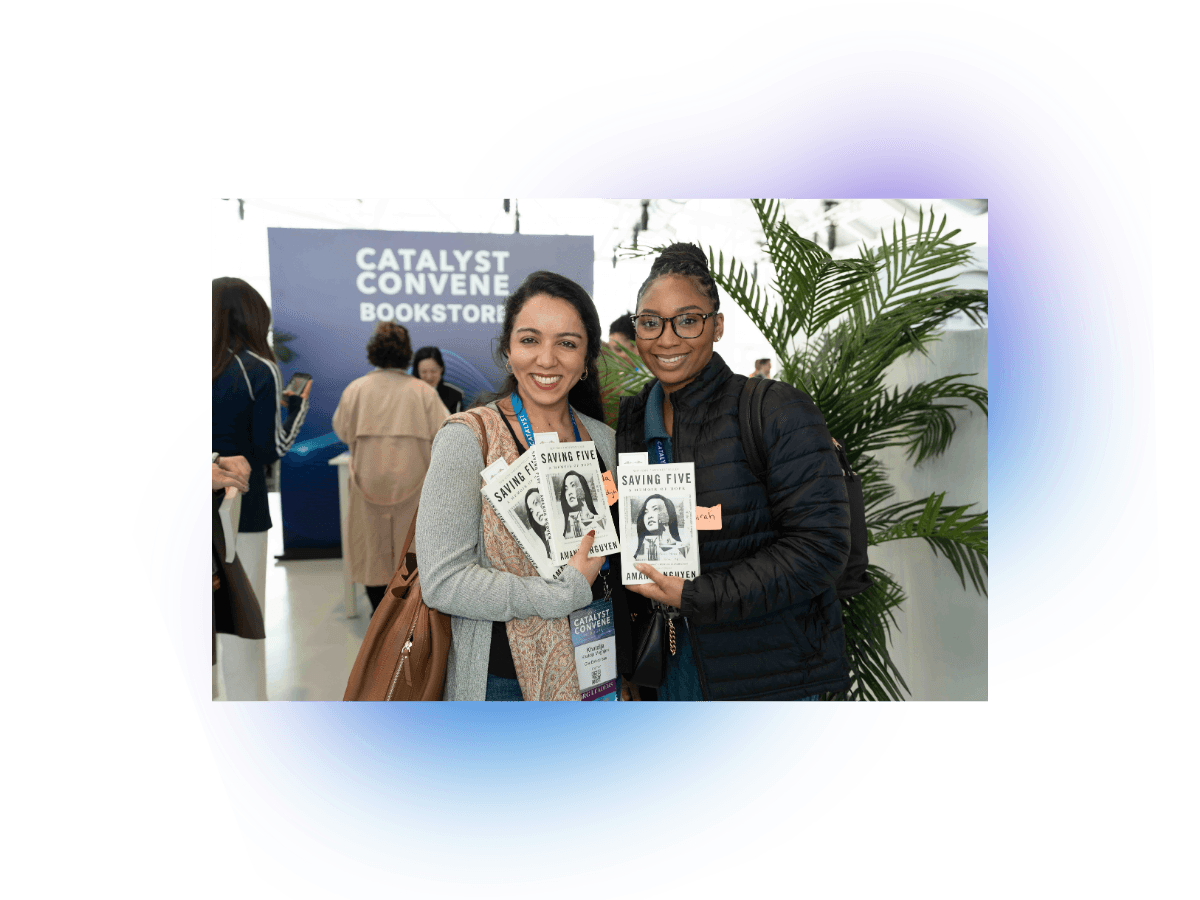 Two conference attendees at the Catalyst Convene bookstore